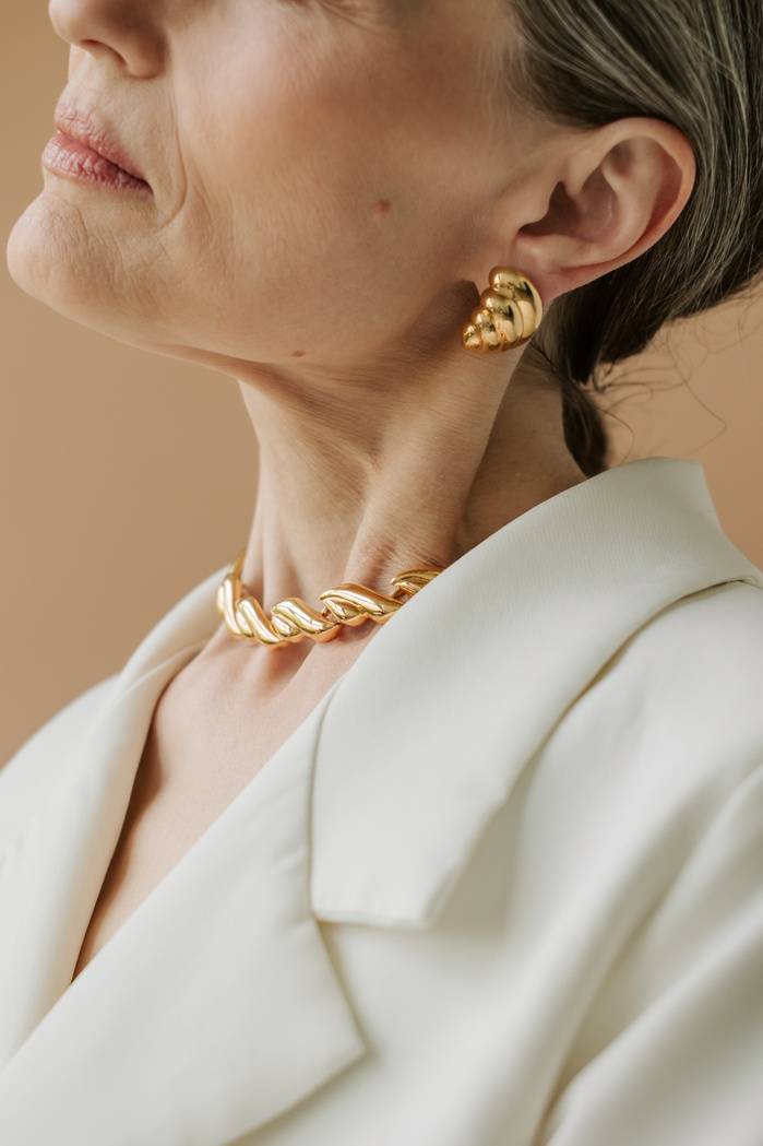 Senior Woman in Gold Earring and Necklace