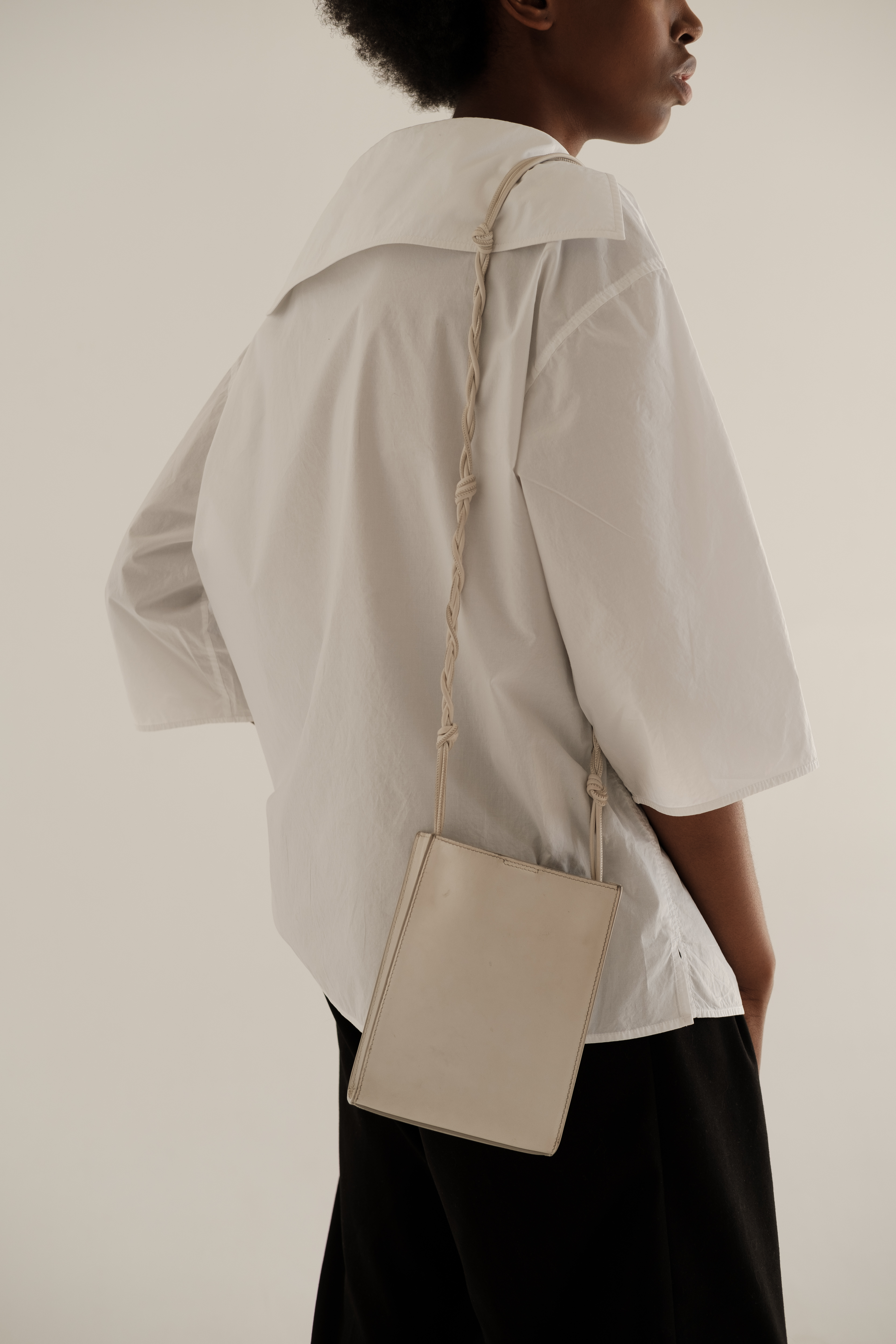 Woman in Casual Dress Shirt and Purse