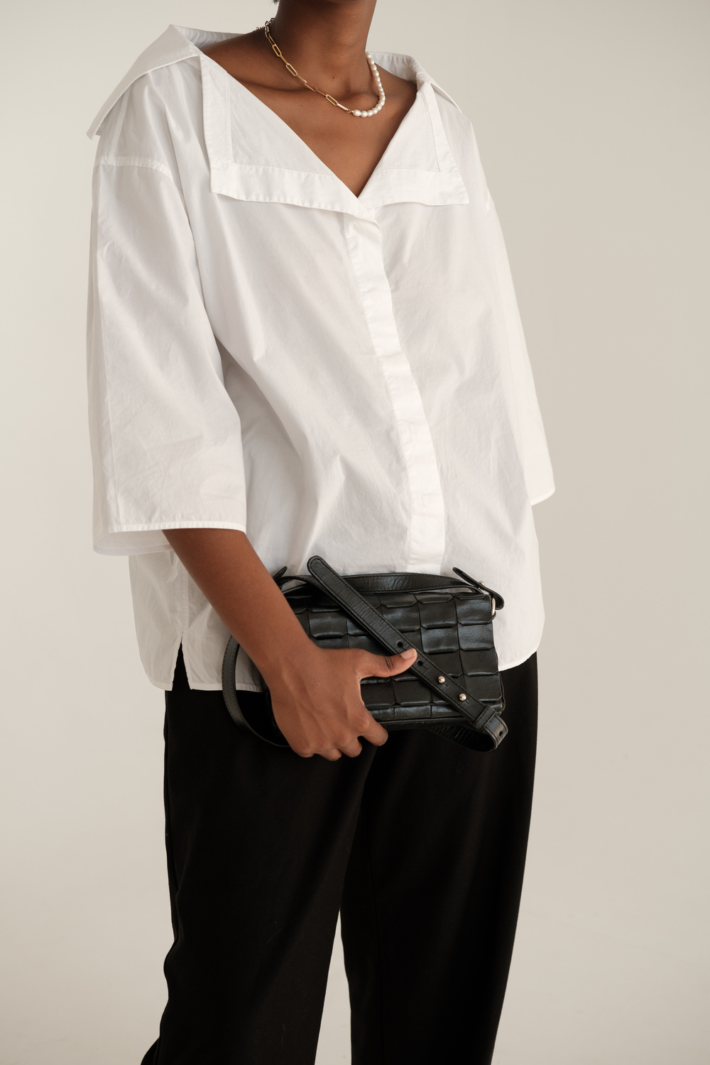 Woman in Casual Dress Shirt and Black Purse